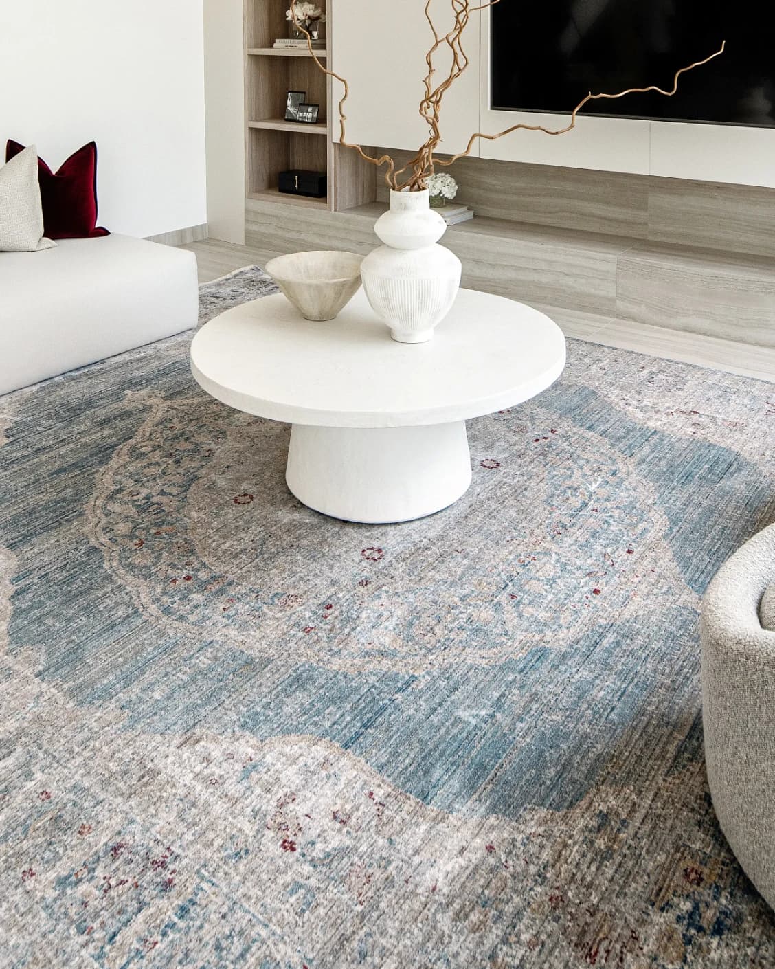 Alexander Sky carpet in pale blue, blue and beige, shown in a lifestyle right view as image 7