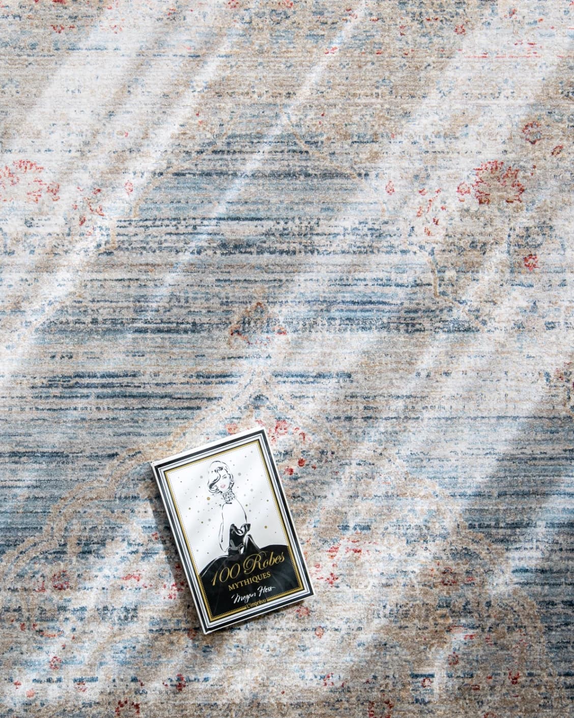 Alexander Sky carpet in pale blue, blue and beige, shown in a lifestyle top view as image 8