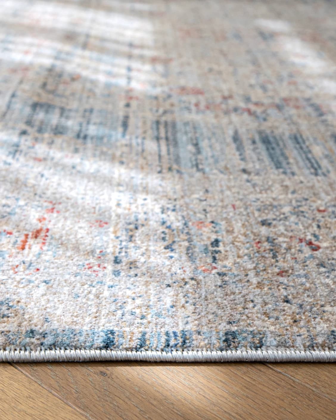 Alexander Sky carpet in pale blue, blue and beige, shown in a product close-up as image 10