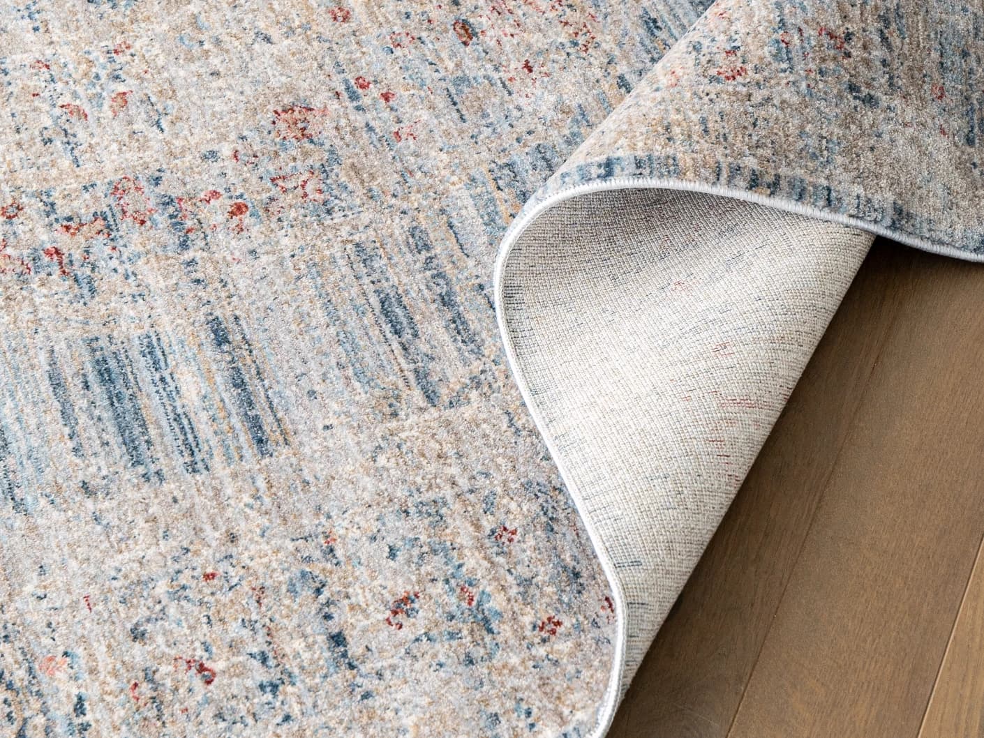 Alexander Sky carpets in sky, pale blue, blue and beige, shown in a product close-up top view