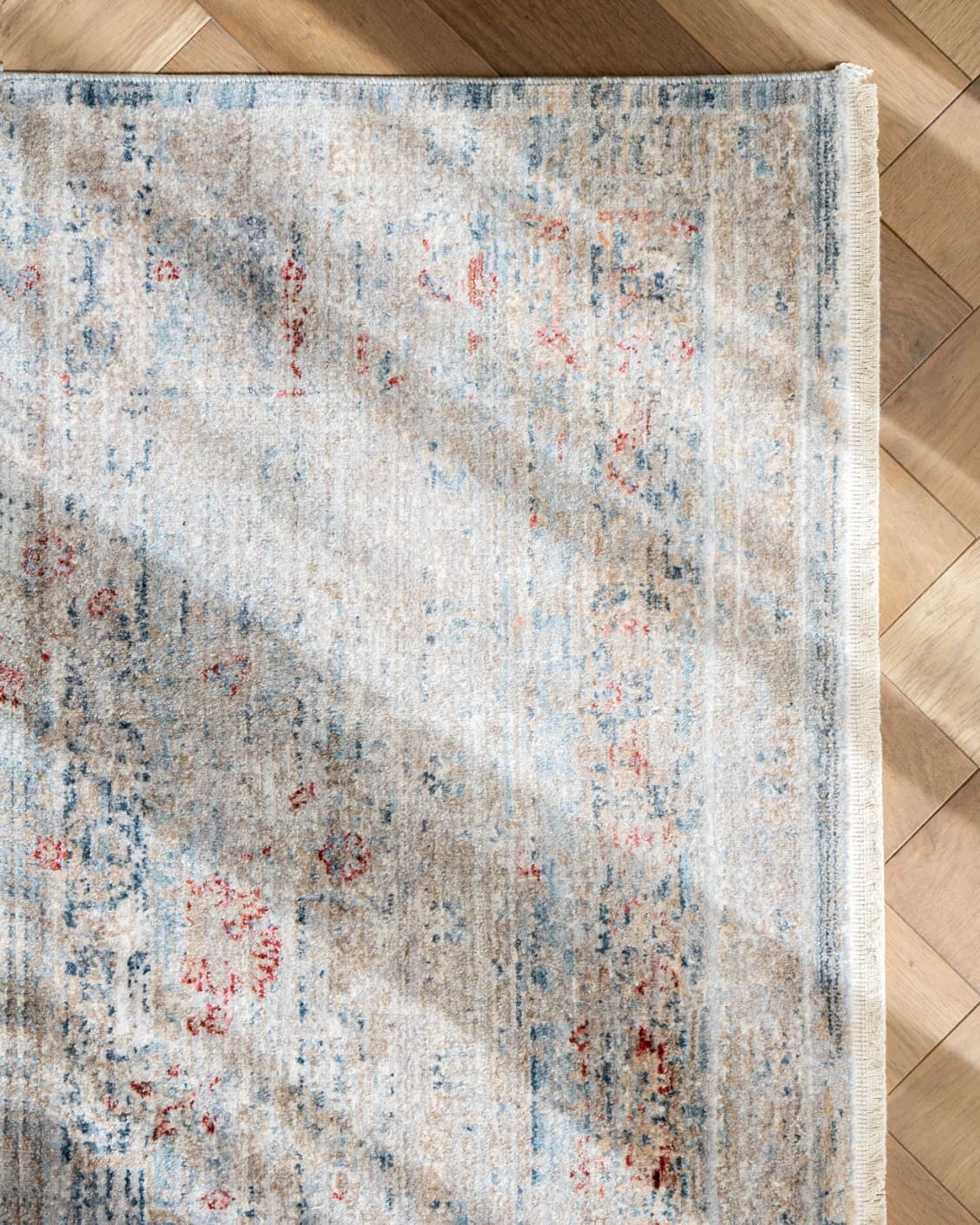 Alexander Sky carpet in pale blue, blue and beige, shown in a product left view as image 15