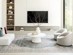 Alexander Sky carpet in sky, pale blue, blue and beige, shown in a lifestyle front view