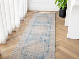 Alexander Sky Runners carpet in pale blue, blue and beige, shown in a product front view