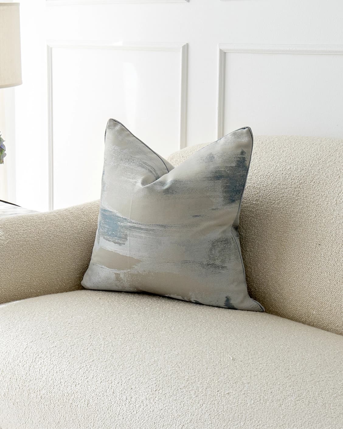 Alma Canova cushion in blue and silver, shown in a lifestyle right view as image 2