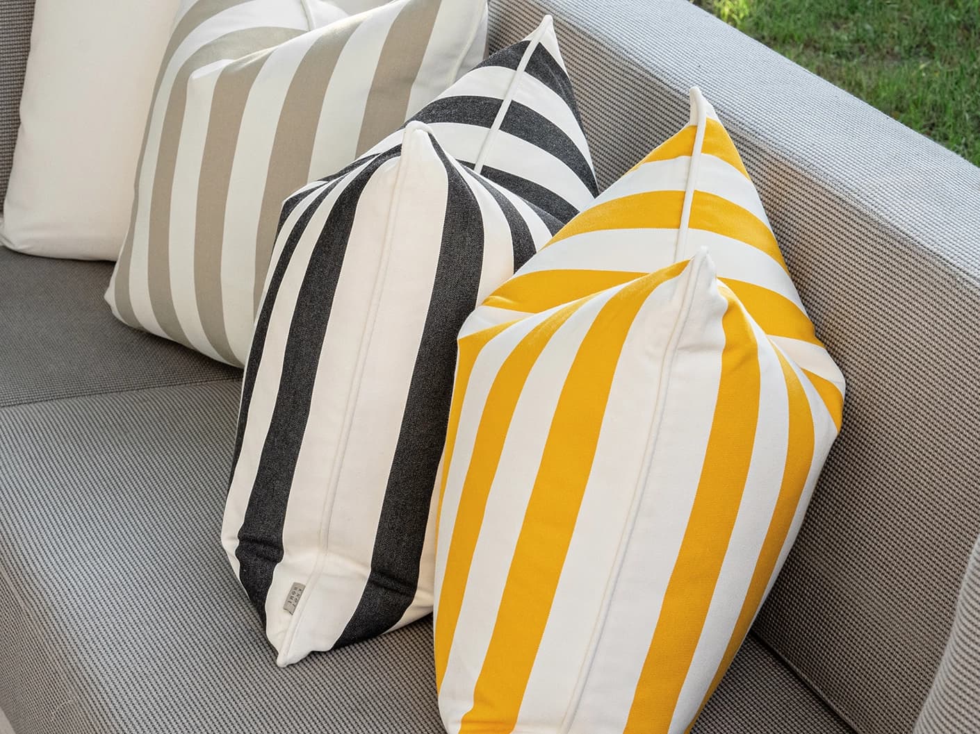 Altan Bundle cushion in soft ivory, black, yellow and beige, shown in a lifestyle front view as image 6