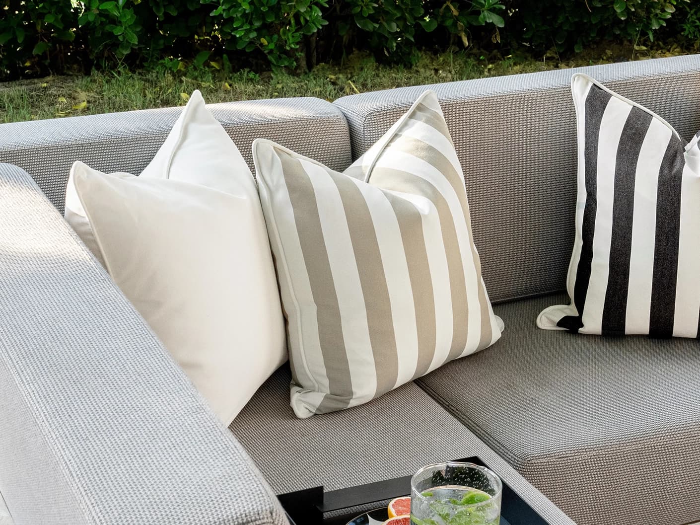 Altan Bundle cushion in soft ivory, black, yellow and beige, shown in a lifestyle front view as image 7
