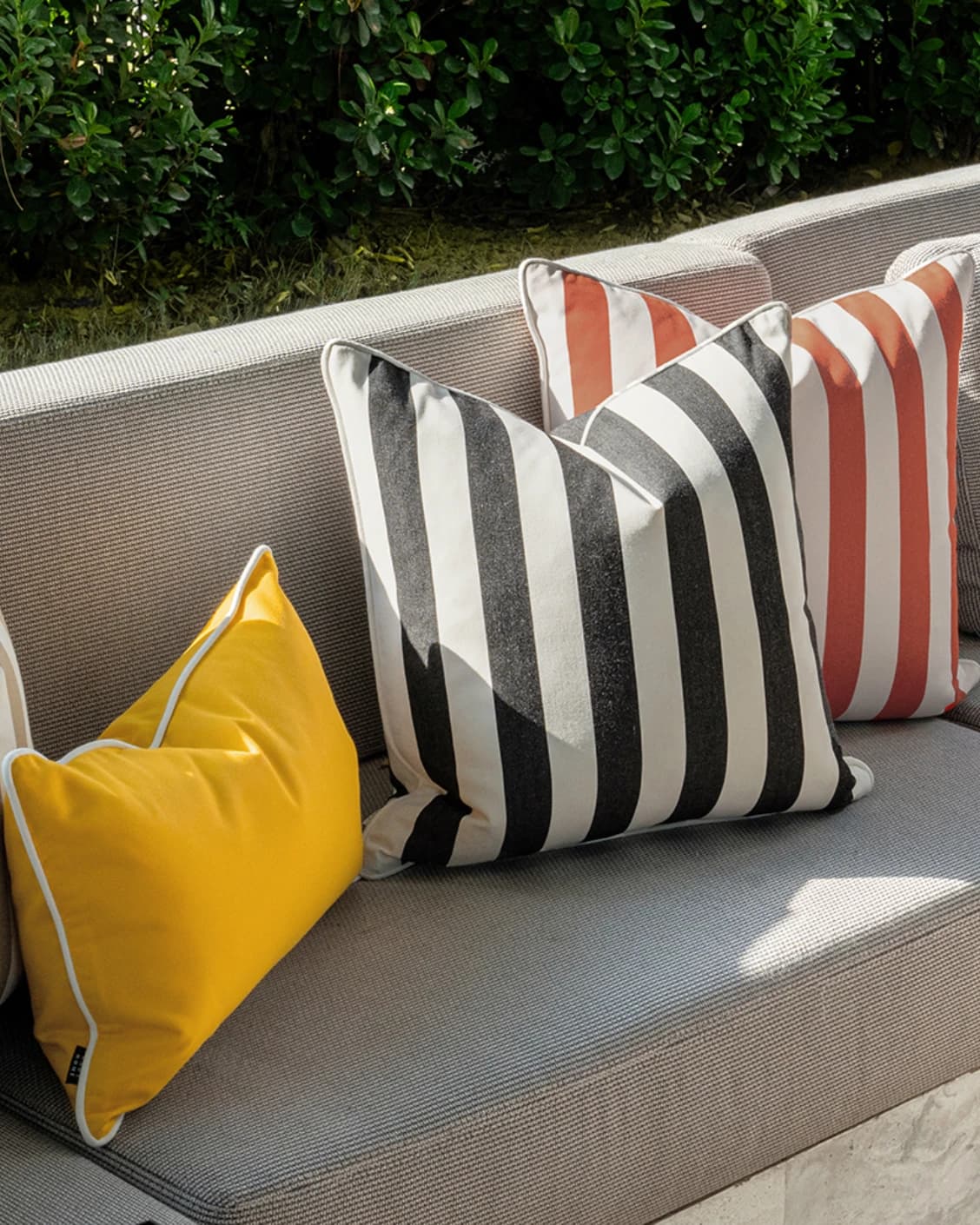 Altan Bundle cushion in soft ivory, black, yellow and beige, shown in a lifestyle front view as image 5