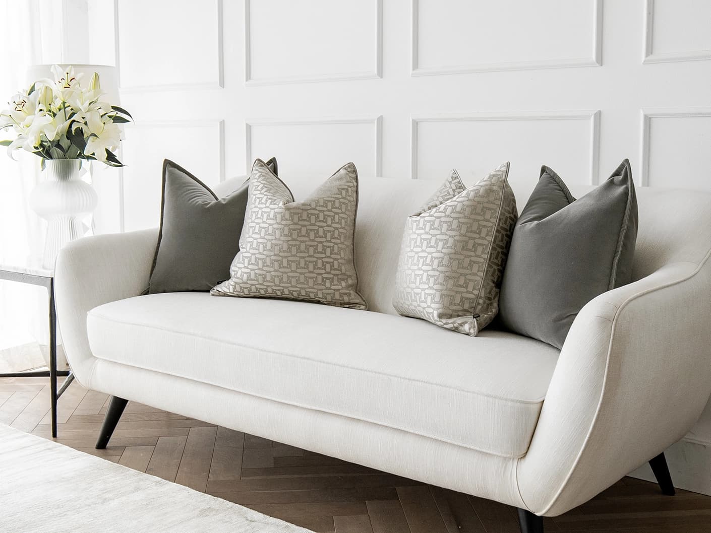 Amara Bundle bundle cushions in grey, beige and silver, shown in a lifestyle front view