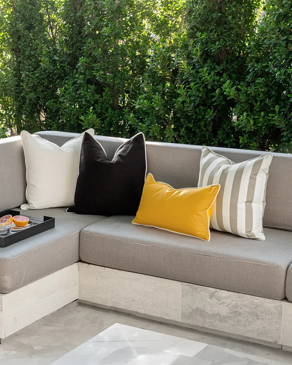 Apollo Bundle cushion in yellow, ivory, beige and black, shown in a lifestyle right view as image 2