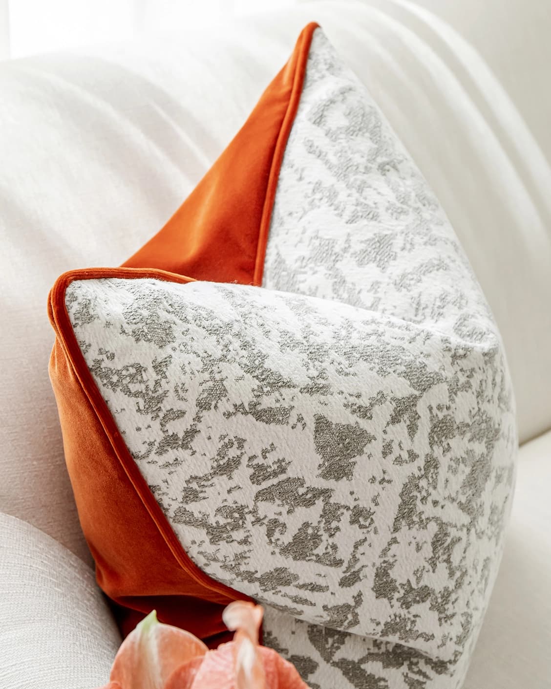 Arcie Tangelo cushion in tangelo, white, grey and orange, shown in a lifestyle left view as image 5