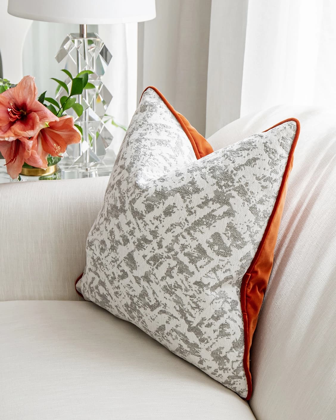 Arcie Tangelo cushion in tangelo, white, grey and orange, shown in a lifestyle right view as image 7