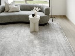 Athena Ashton carpet in grey and off white, shown in a lifestyle front view