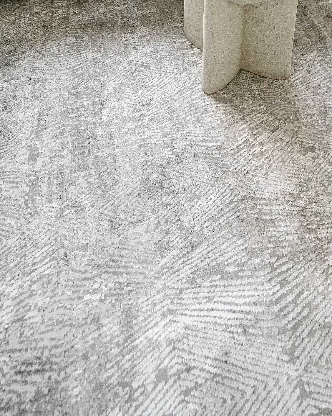 Athena Ashton carpet in grey and off white, shown in a lifestyle close-up as image 6