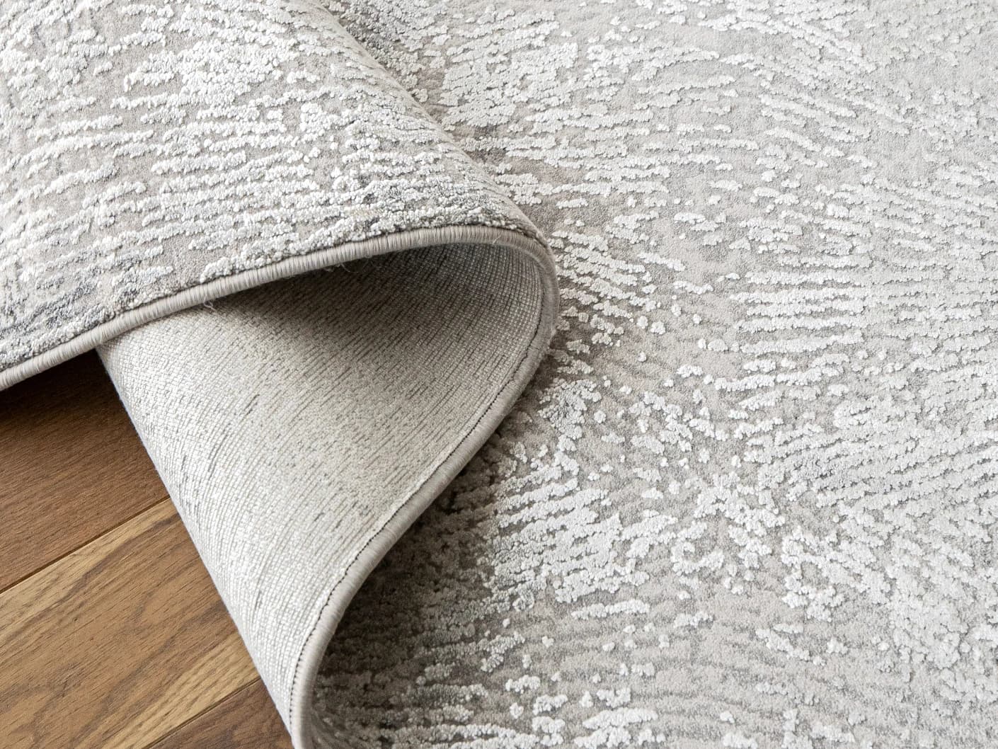 Athena Ashton carpets in grey and off white, shown in a product close-up view