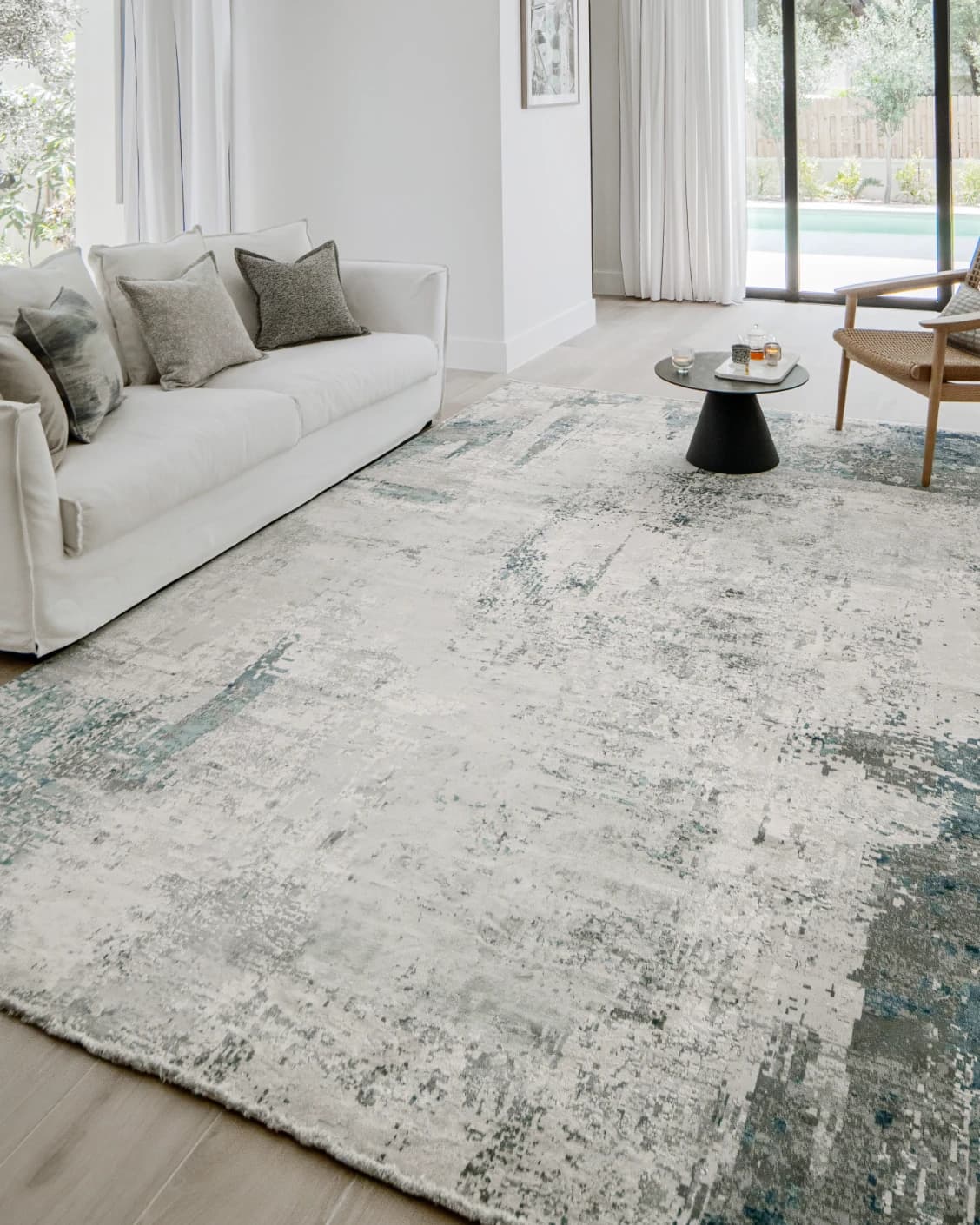 Athena Sky carpet in sky, blue and grey, shown in a lifestyle left view as image 7