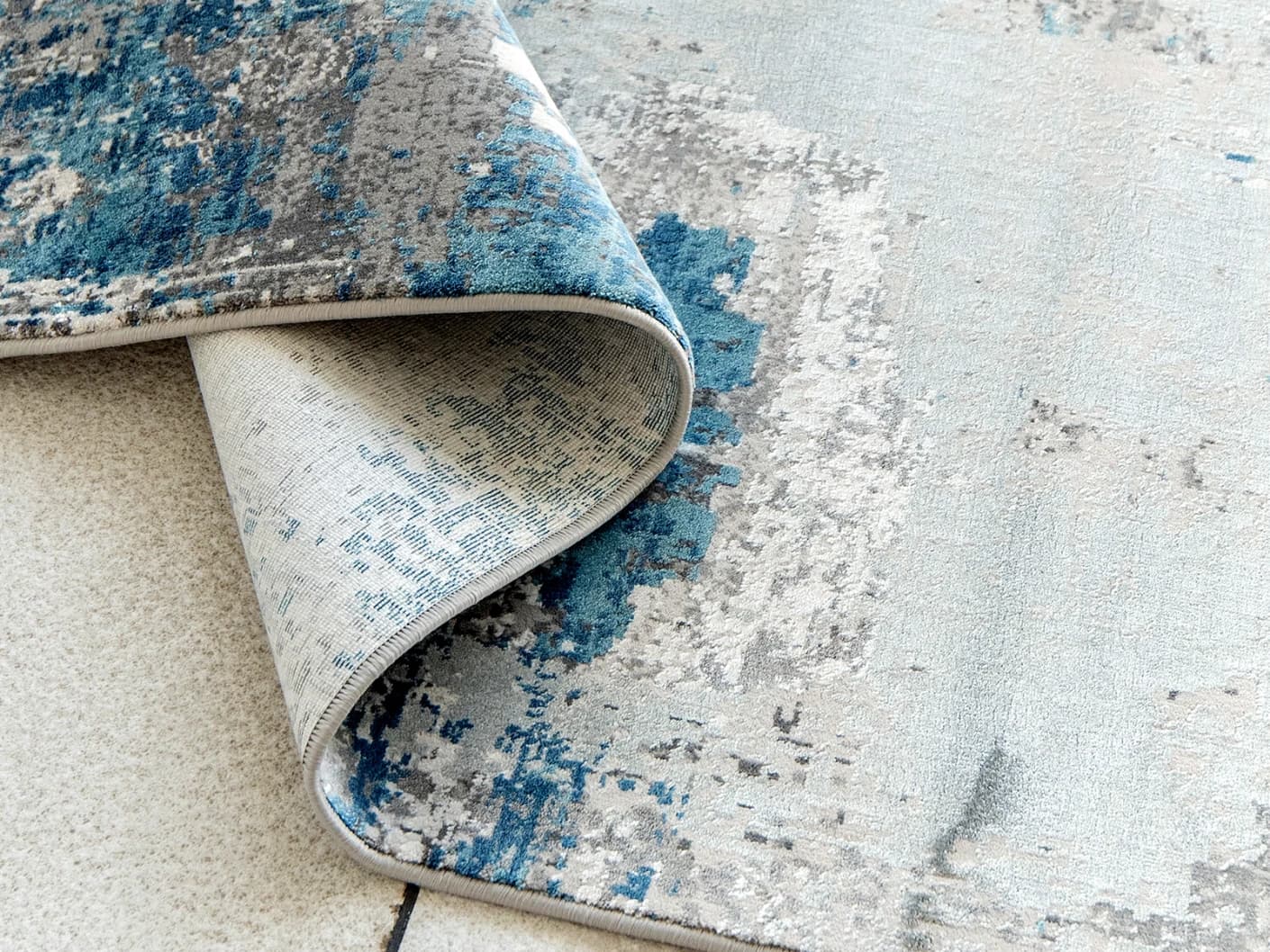 Athena Sky Runners carpets in sky, blue and grey, shown in a product close-up top view