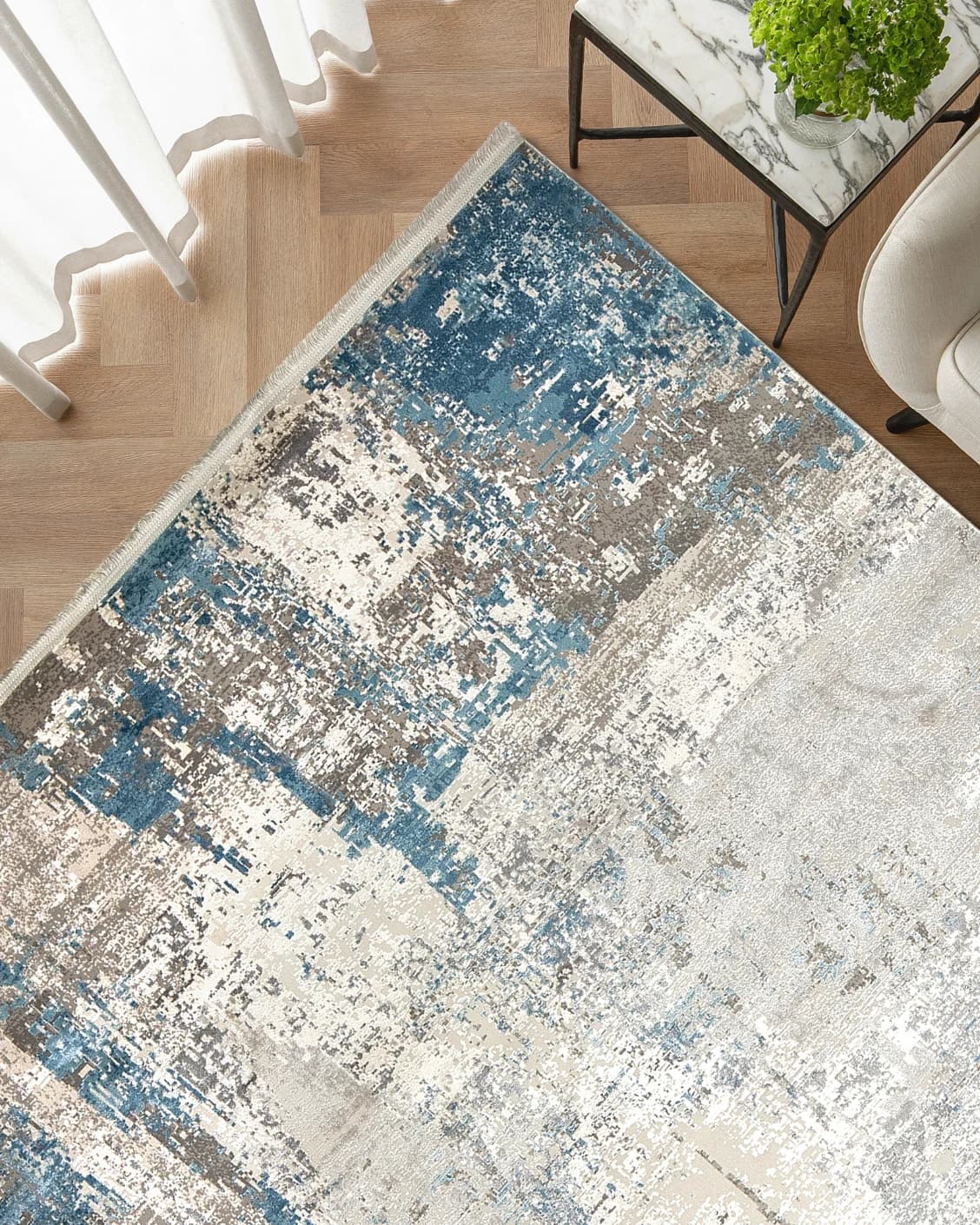 Athena Sky carpet in sky, blue and grey, shown in a lifestyle top view as image 2