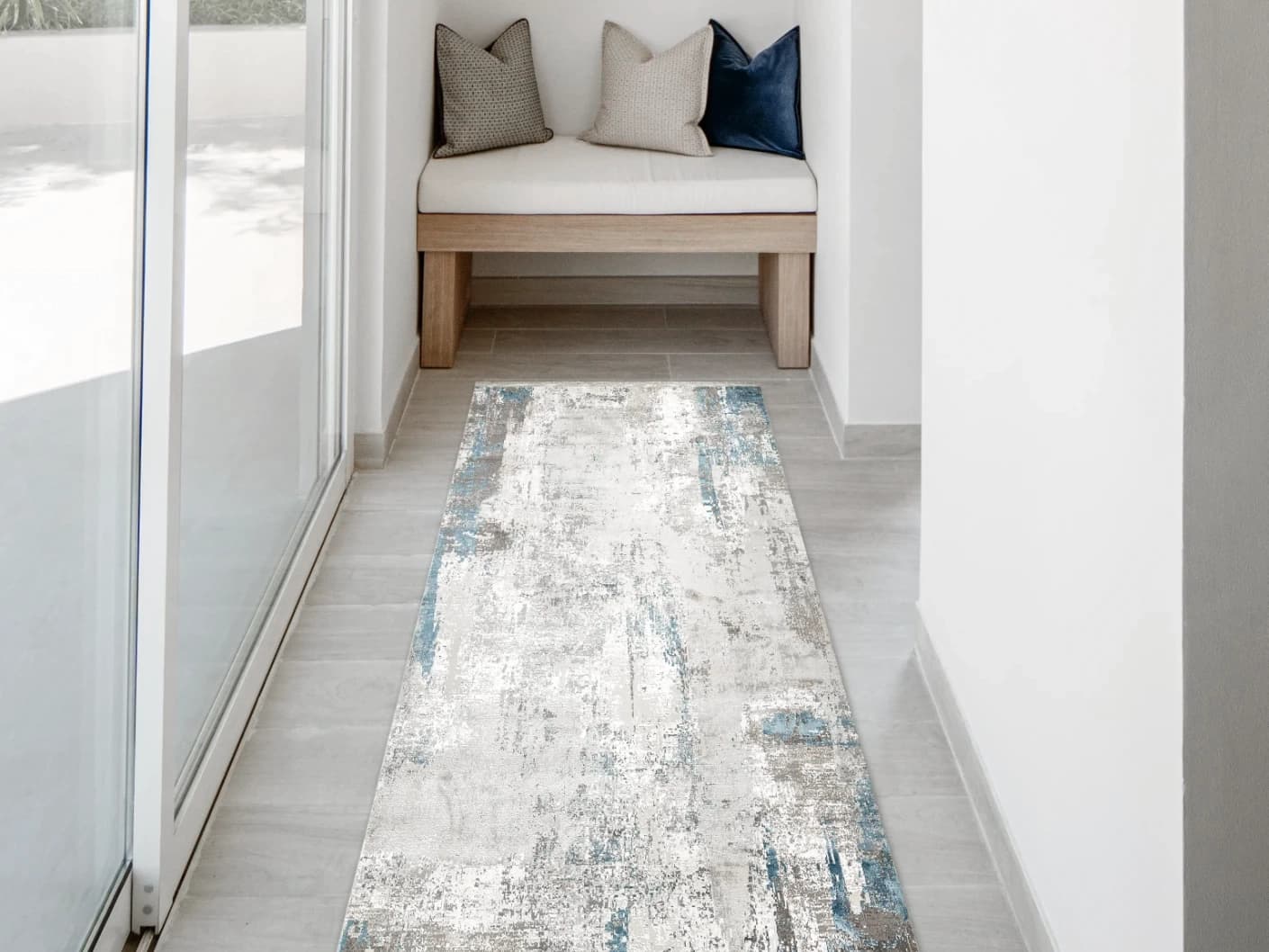Athena Sky Runners carpet in blue and grey, shown in a lifestyle front view