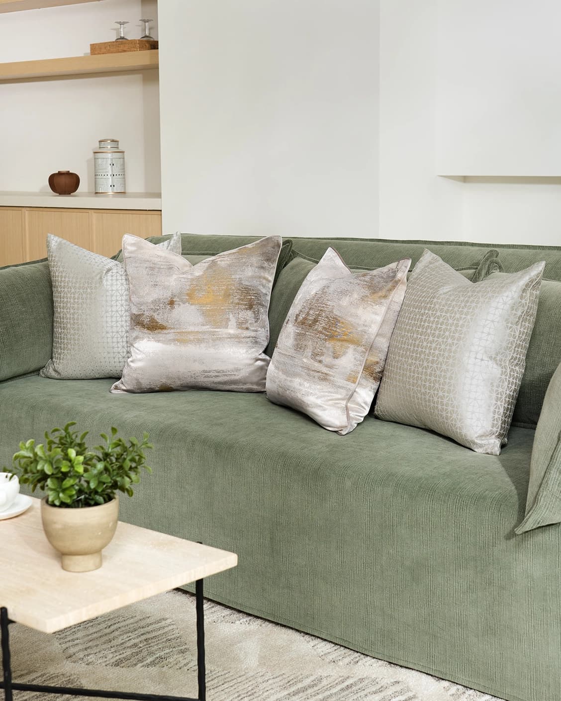 Aurelia Bundle bundle cushions in yellow, silver and white, shown in a lifestyle front view