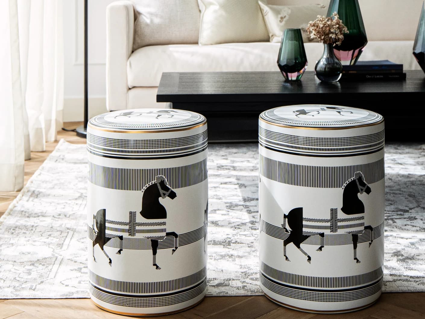 Aurora Jacobsen stools in white and black, shown in a lifestyle front view