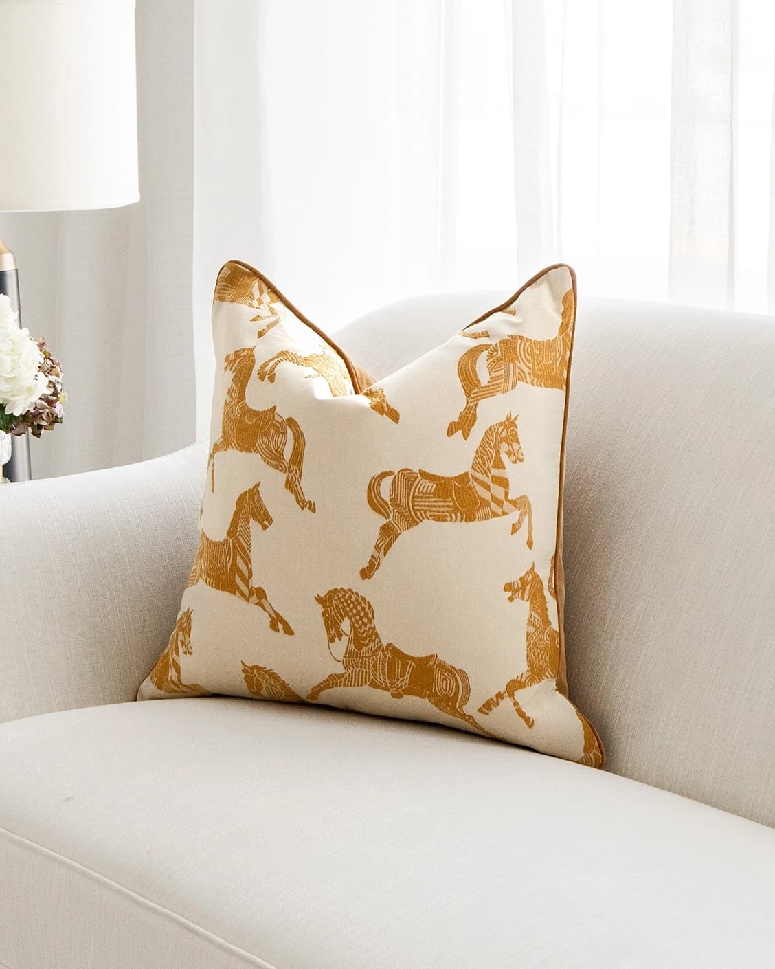 Aurora Klimt cushion in orange and beige, shown in a lifestyle right view as image 2