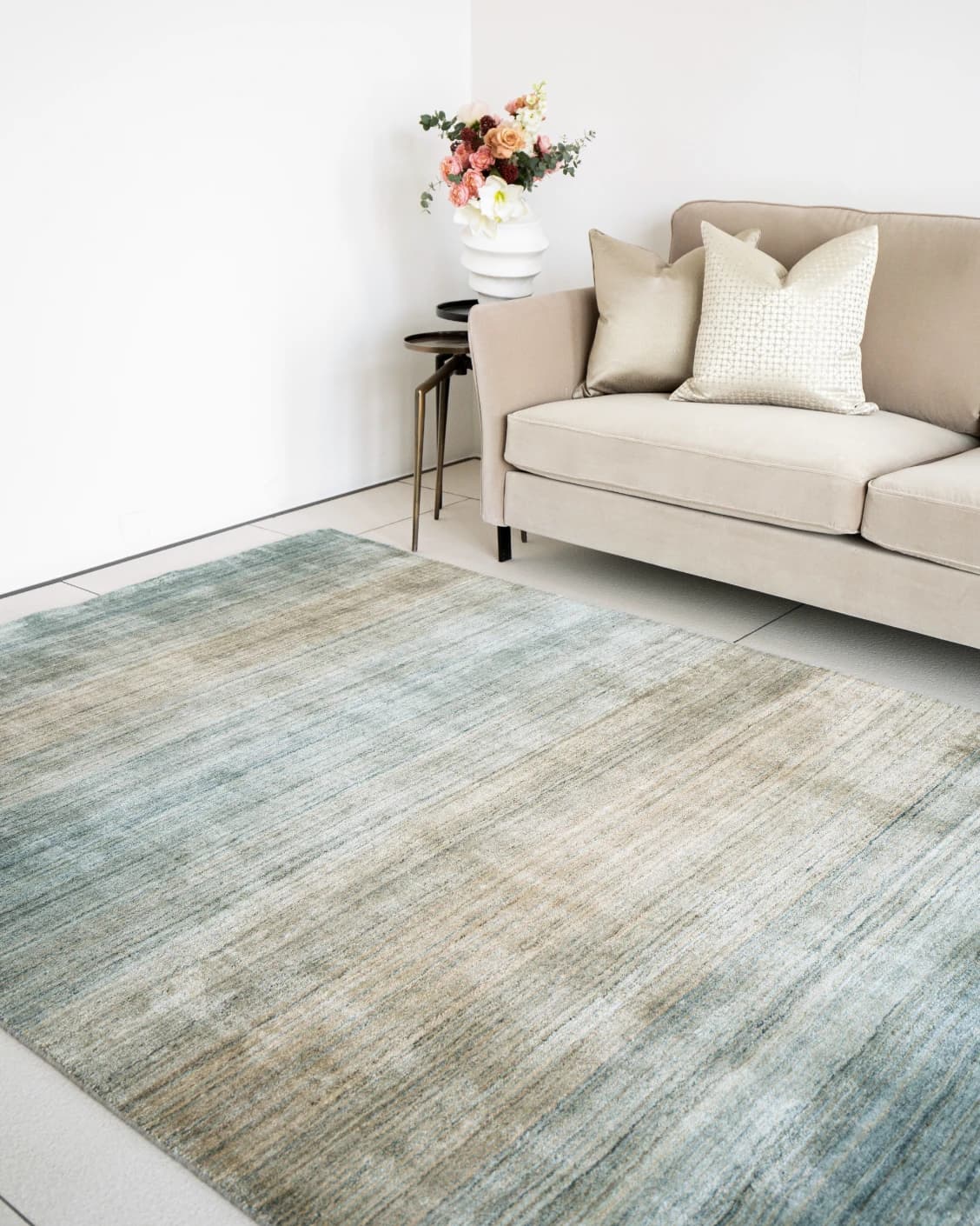 Ava Sandy carpets in turquoise and beige, shown in a lifestyle right view as image 1