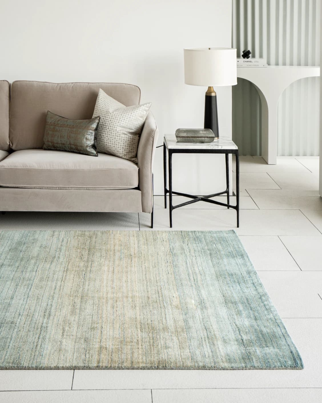 Ava Sandy carpets in turquoise and beige, shown in a lifestyle right view as image 2