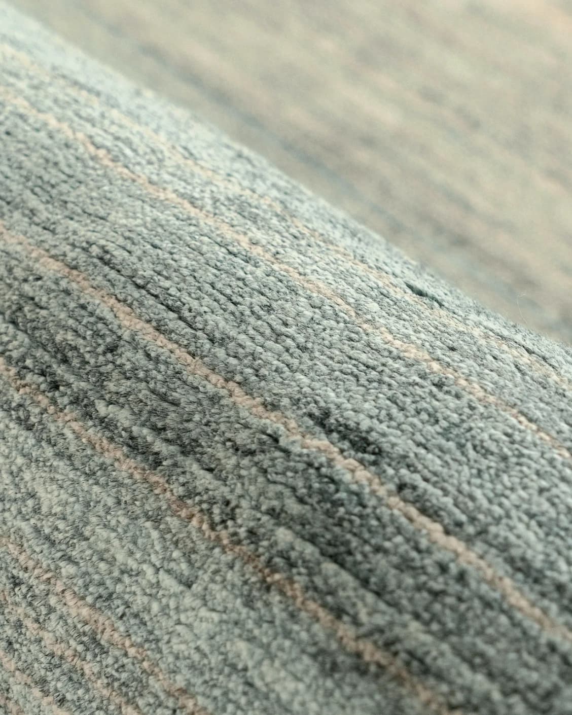 Ava Sandy carpet in sandy, turquoise and beige, shown in a product close-up as image 7