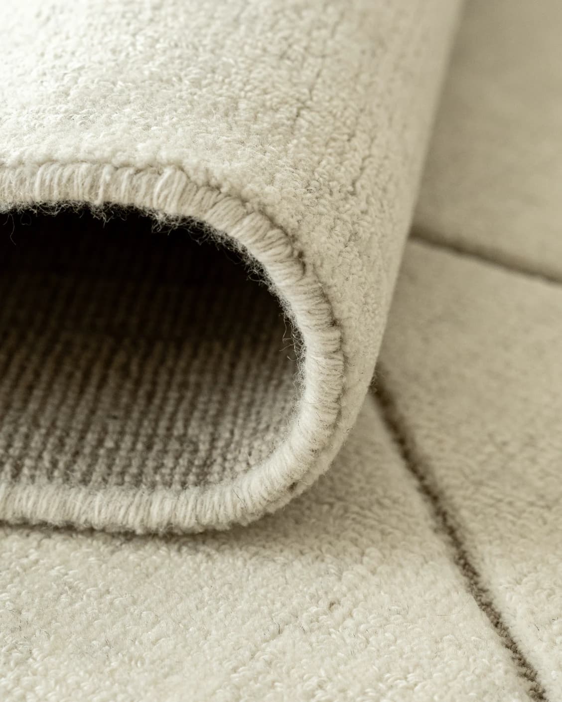 Axis Bianca carpet in beige, shown in a product close-up front view as image 10