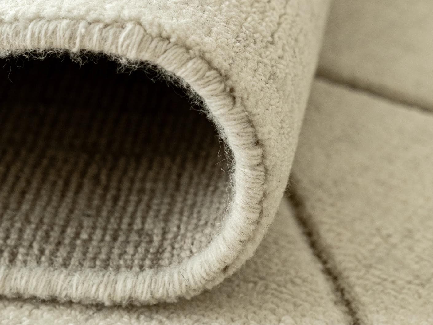 Axis Bianca carpet in beige, shown in a product close-up front view as image 10