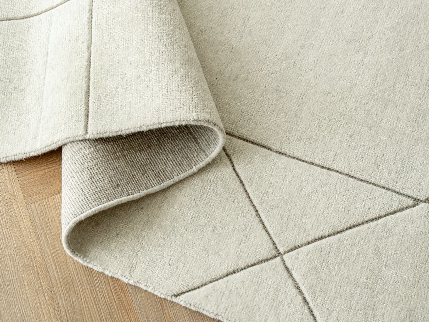Axis Bianca carpets in beige, shown in a product close-up top view
