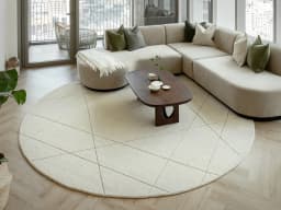 Axis Bianca Round carpet in beige, shown in a lifestyle front view