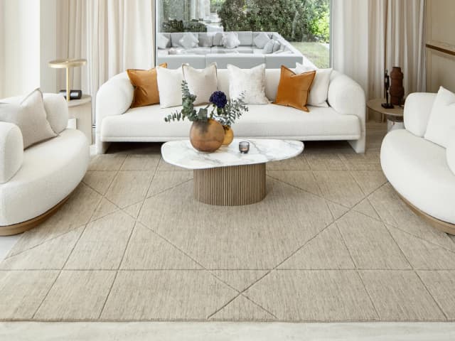 Axis Oat carpet in beige and brown, shown in a lifestyle close-up front view