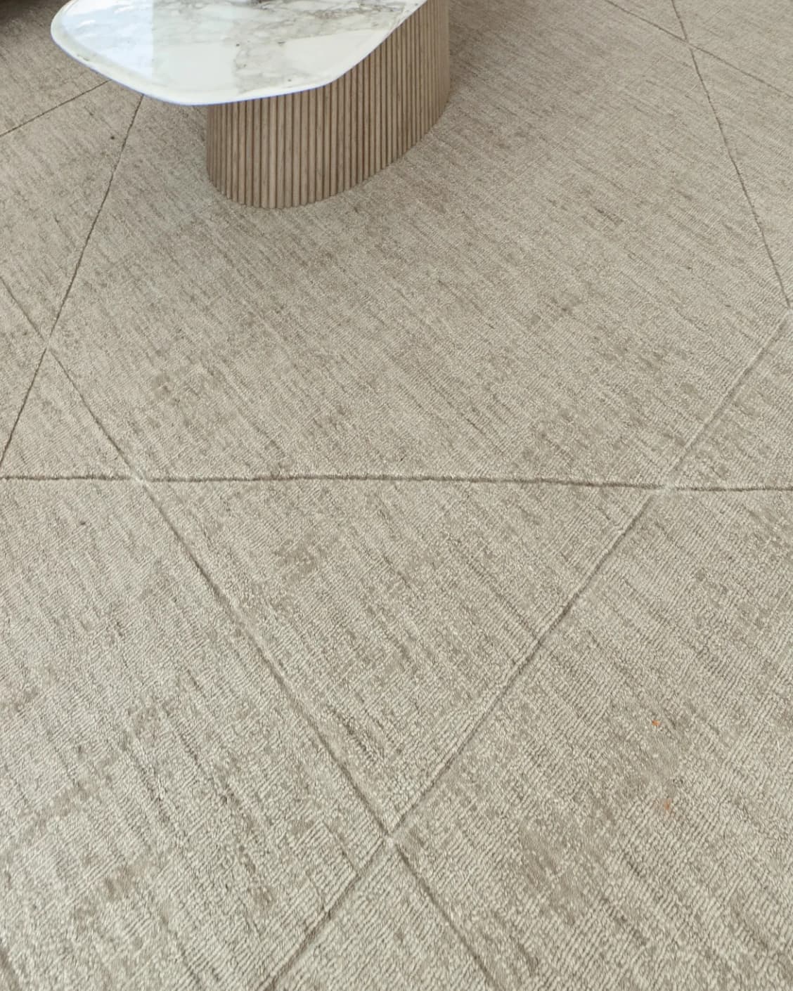 Axis Oat carpet in beige and brown, shown in a lifestyle close-up top view as image 4