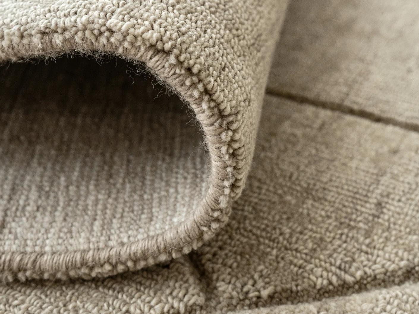 Axis Oat carpets in beige and brown, shown in a product close-up front view as image 2