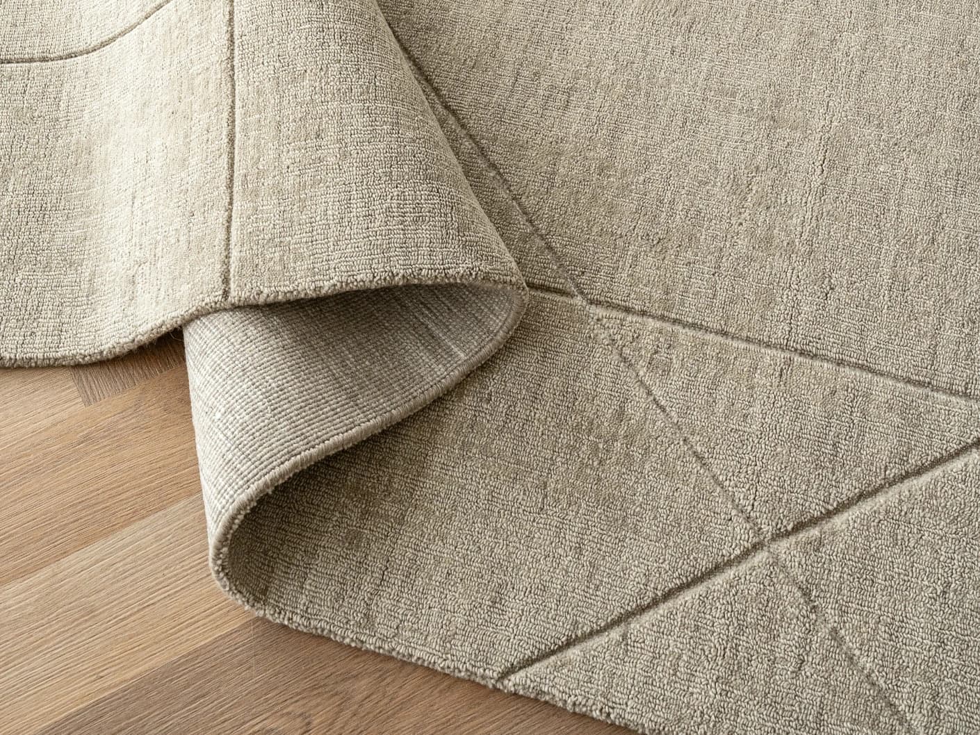 Axis Oat carpets in beige and brown, shown in a product close-up top view