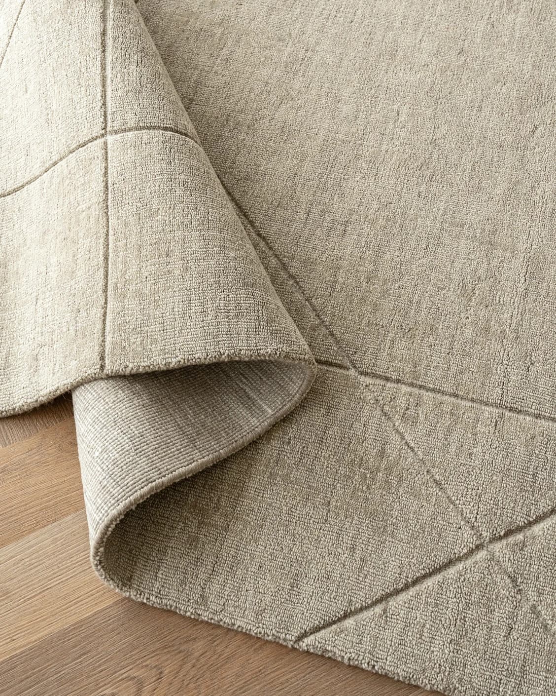 Axis Oat carpets in beige and brown, shown in a product close-up top view as image 1