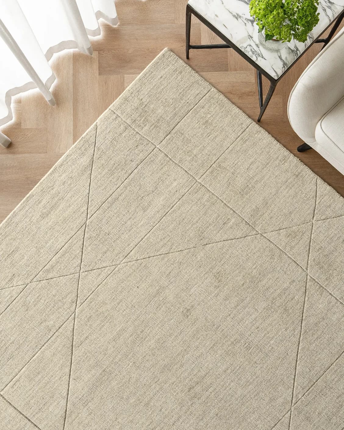 Axis Oat carpet in beige and brown, shown in a lifestyle top view as image 2