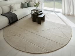 Axis Oat Round carpet in beige and brown, shown in a lifestyle front view