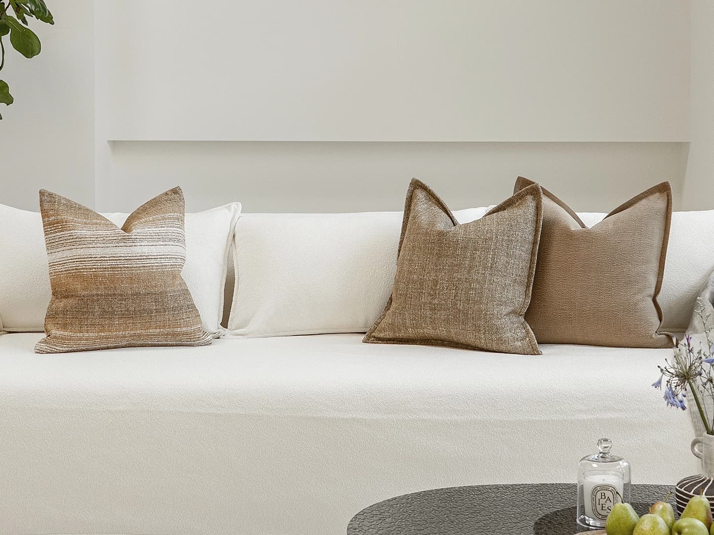 Aya Bundle bundle cushions in brown, shown in a lifestyle front view