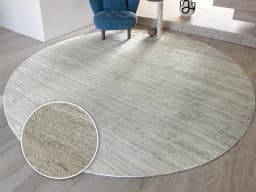 Beatrice Alba Round carpet in grey, shown in a lifestyle front view
