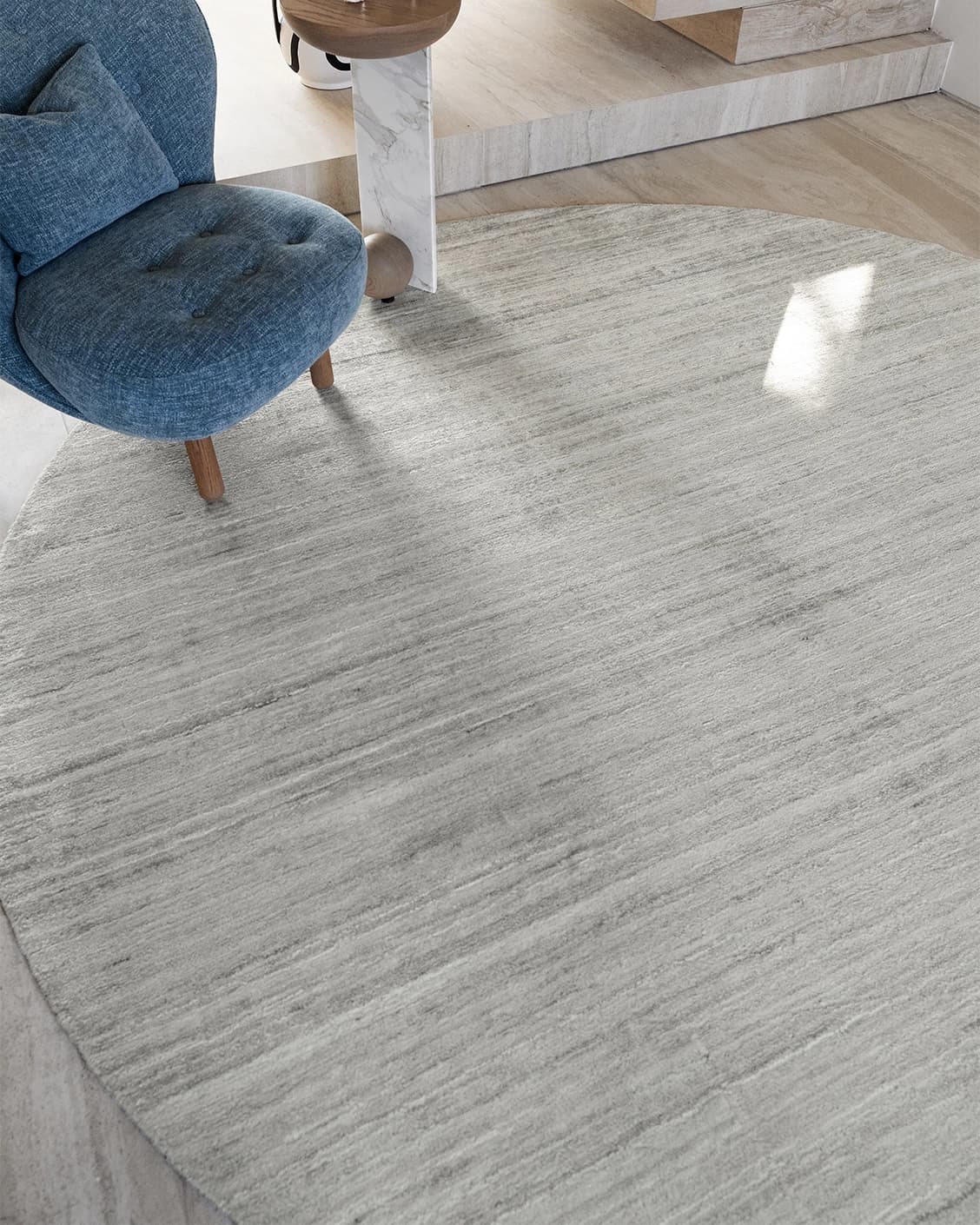 Beatrice Alba Round carpet in grey, shown in a lifestyle front view as image 4
