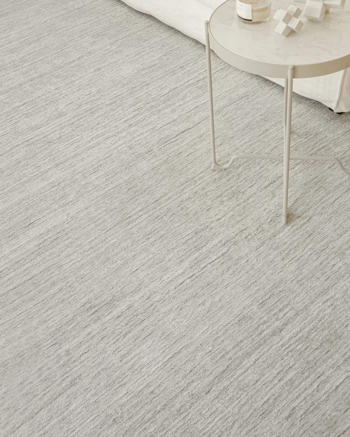 Beatrice Alba carpet in grey, shown in a lifestyle close-up as image 4