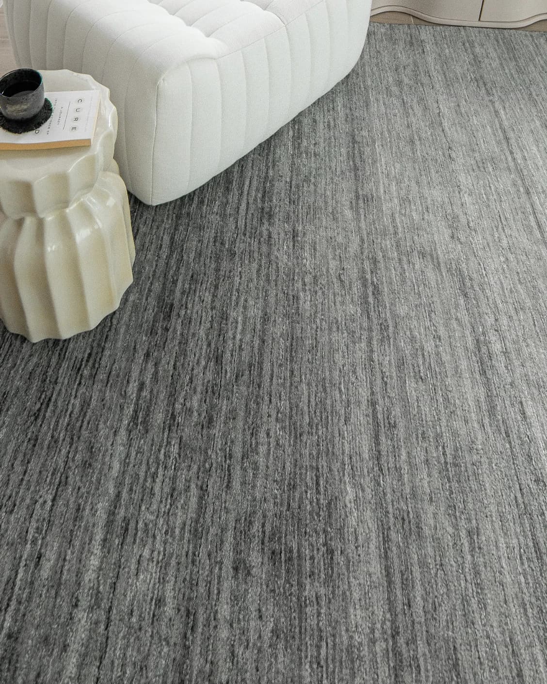 Beatrice Ashton carpet in grey, shown in a lifestyle close-up top view as image 5