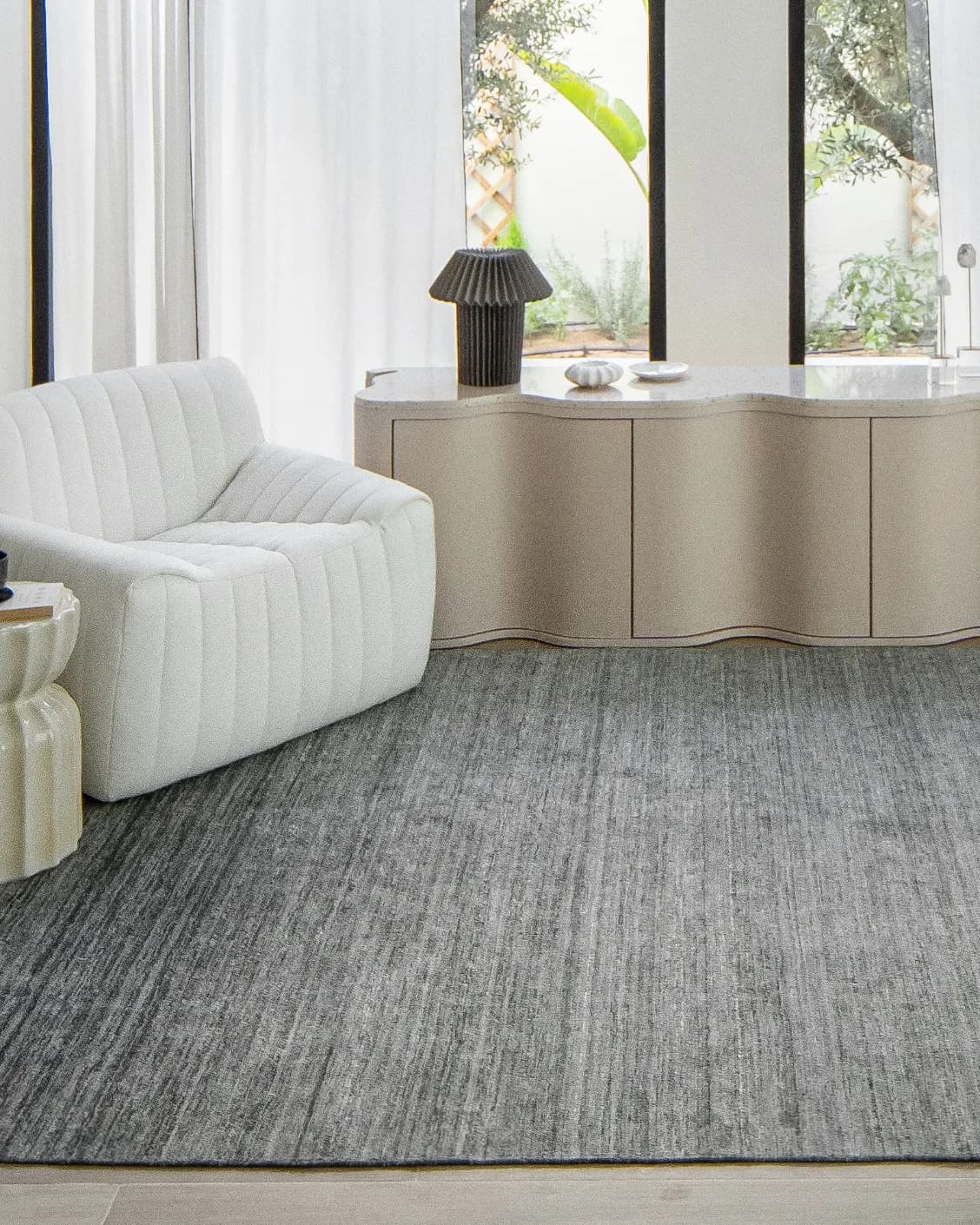 Beatrice Ashton carpet in grey, shown in a lifestyle front view as image 6