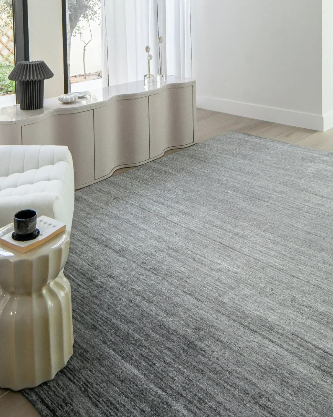 Beatrice Ashton carpet in grey, shown in a lifestyle left view as image 9