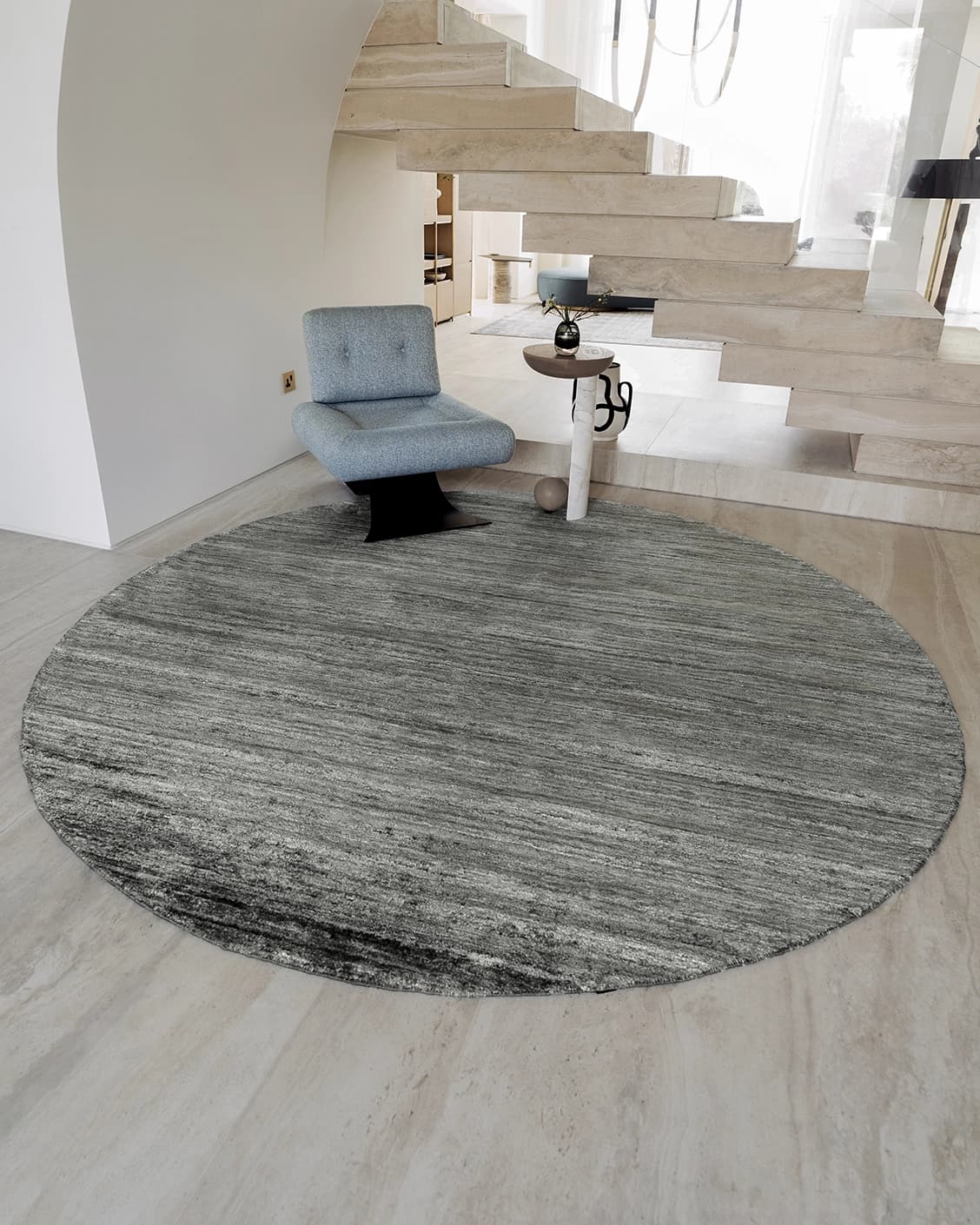 Beatrice Ashton Round carpet in grey, shown in a lifestyle front view as image 2