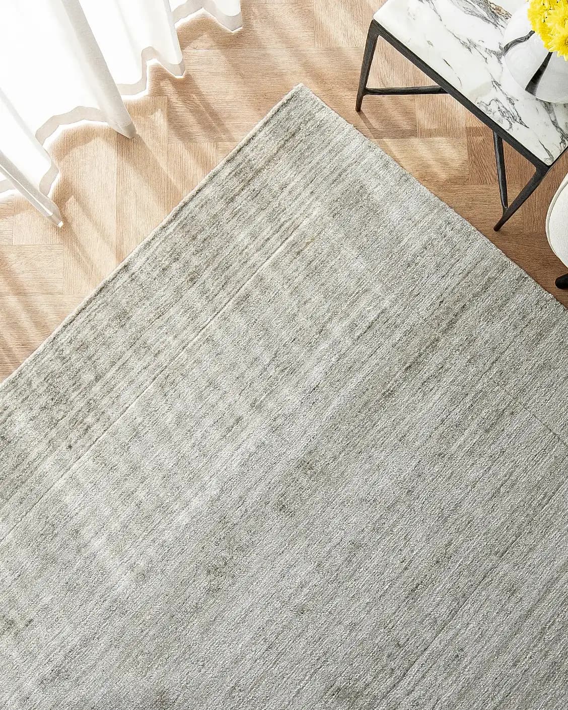 Beatrice Dune 01 carpet in dune and grey, shown in a lifestyle top view as image 2