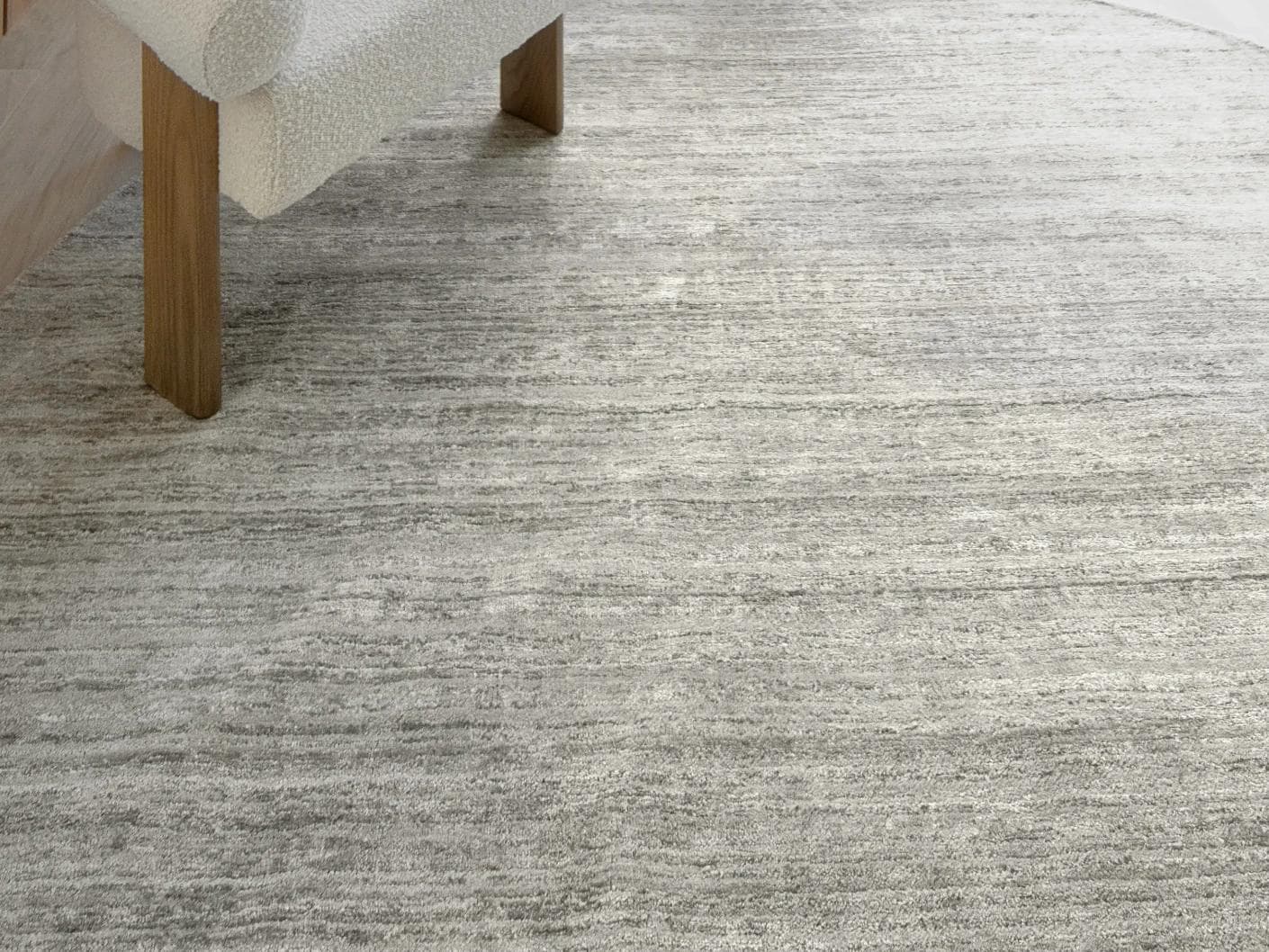 Beatrice Dune 02 carpets in grey, shown in a lifestyle close-up as image 1