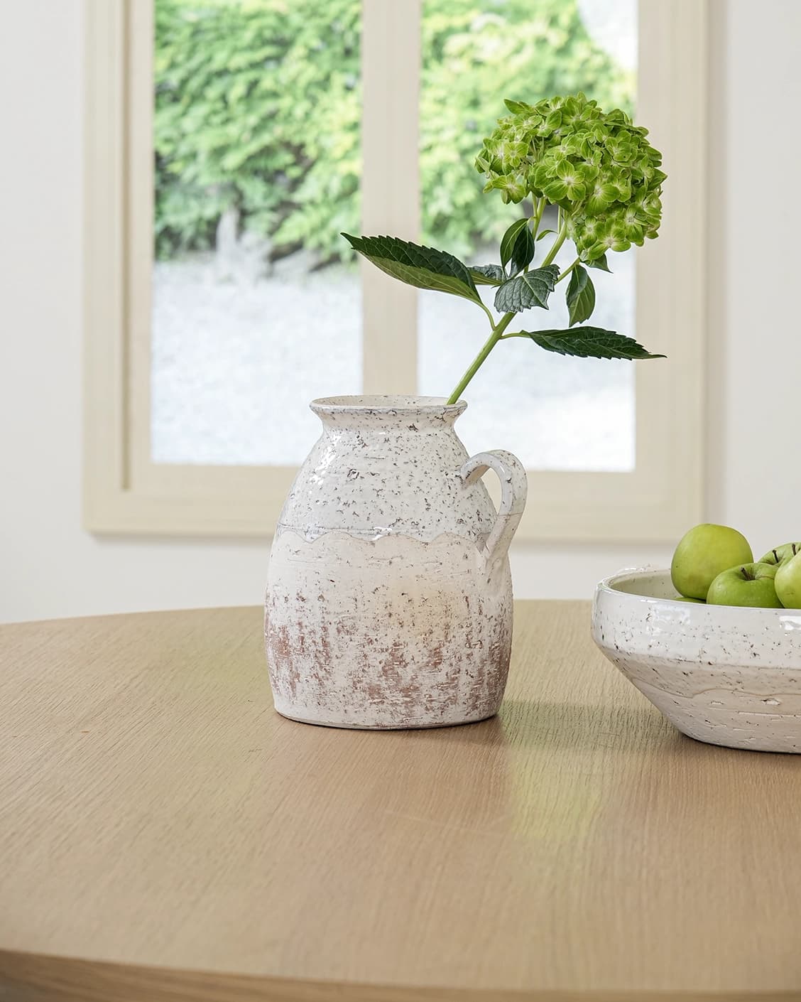 Becca Terra vases in soft stone and white, shown in a lifestyle front view as image 2